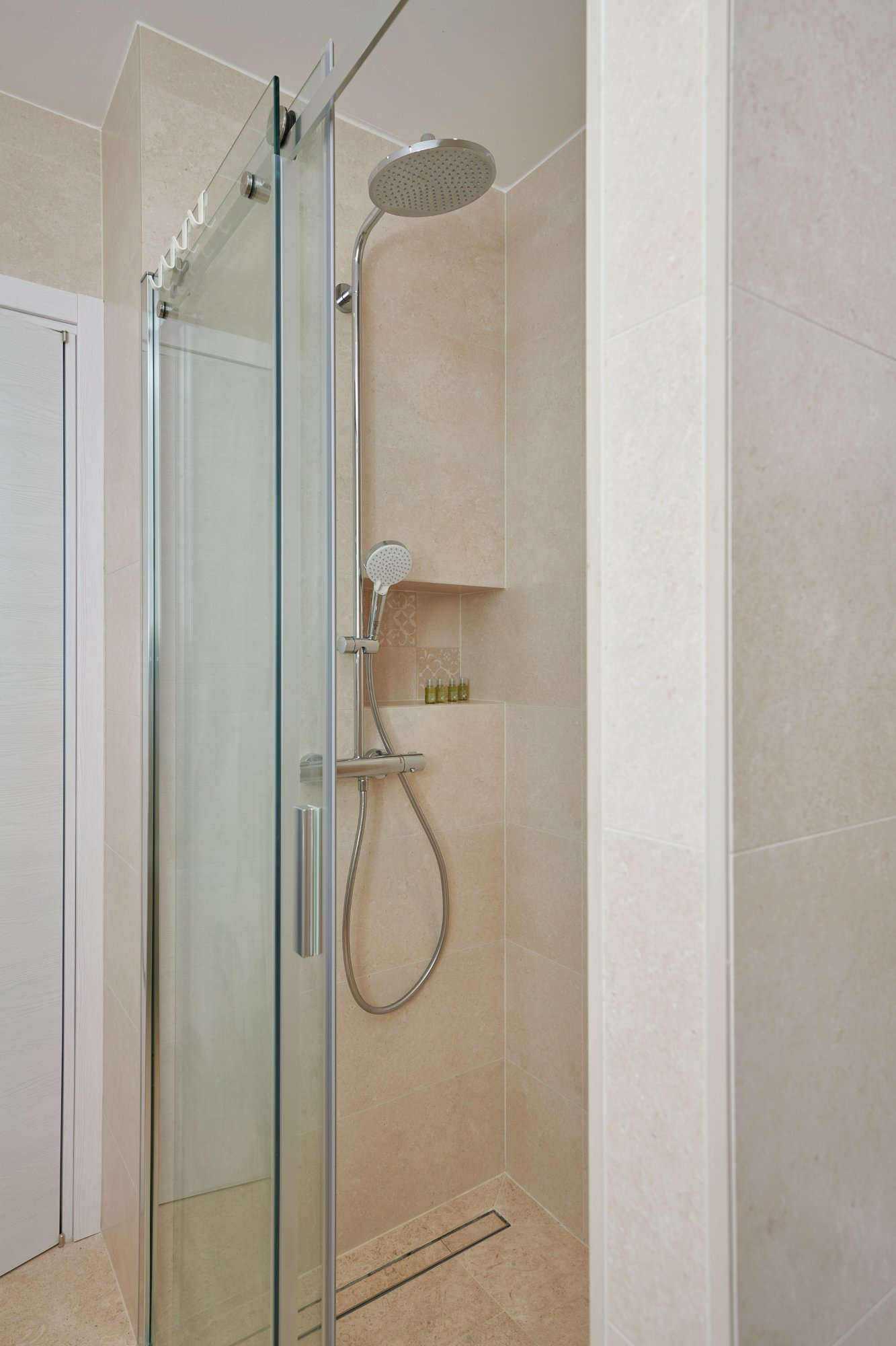 Bathroom with natural stone and walk-in shower