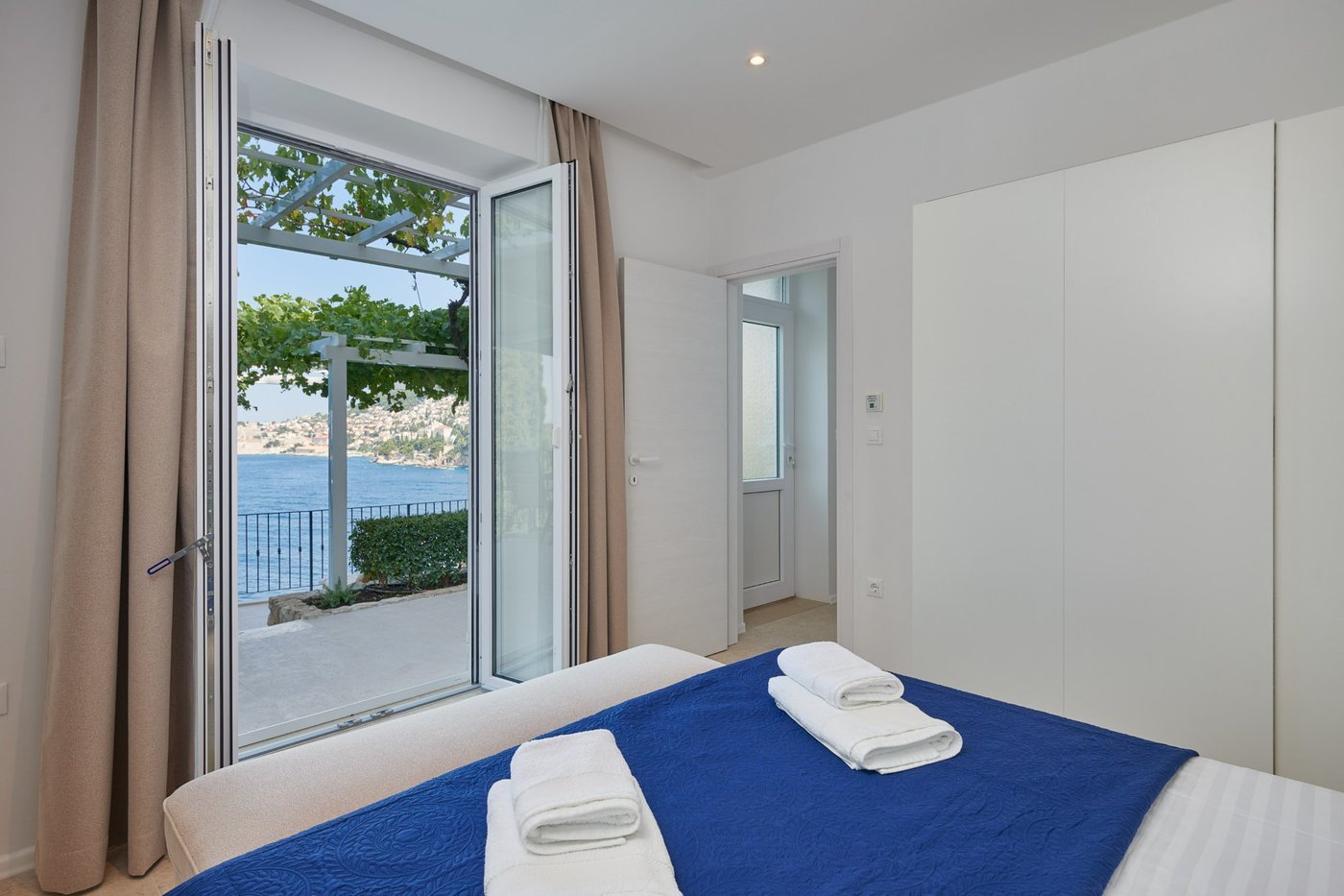 Master bedroom with French doors to terrace